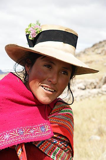 A Chola (local woman) with a flower-strewn hat, nearby their shepherd hut, Hatun Machay, Cordillera Negra 2008