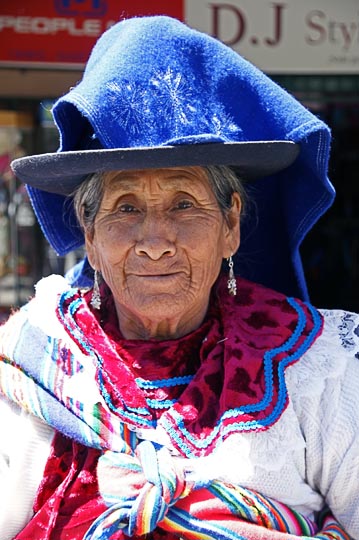 A Chola (local woman) with a decorated hat in the main street, Huaraz 2008