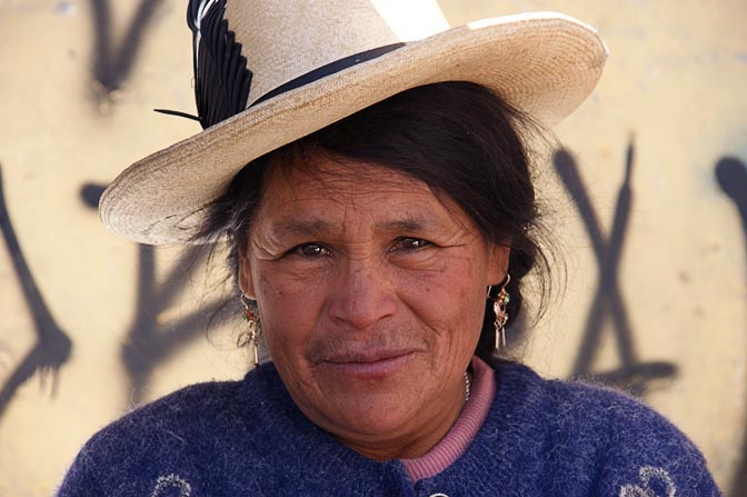 A Chola (local woman) with a ribbon decorated hat in the local market, Huaraz 2008