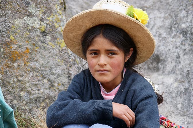 A young student with a decoated hat at a school picnic, Hatun Machay, Cordillera Negra 2008