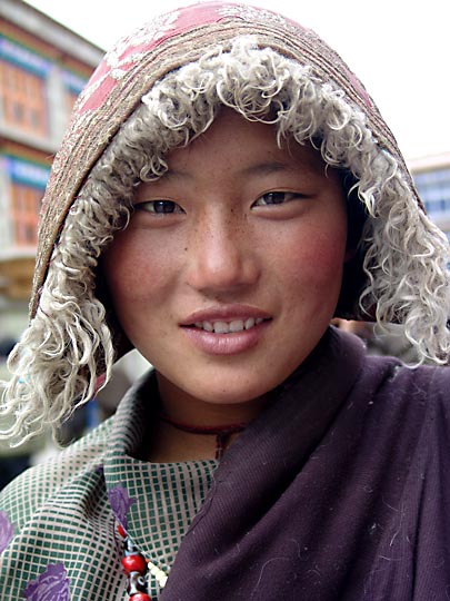 A Tibetan young woman along by the Lingkor around the Jokhang, Lhasa 2004