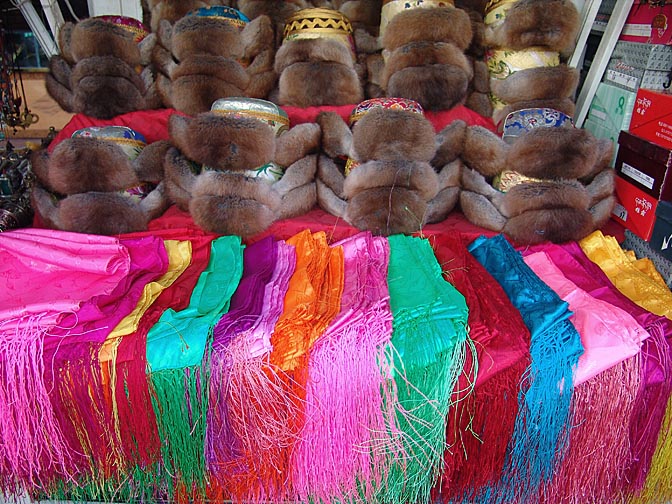 Fur hats and colored shawls in the Barkhor Market, Lhasa 2004