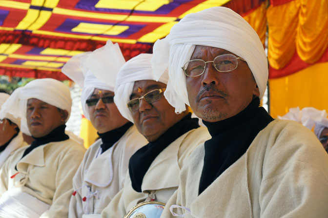 Men dressed in traditional Rung attentive to the ceremony, Pangu 2011
