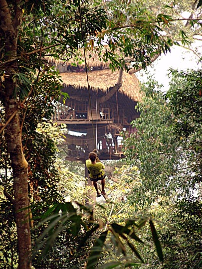Brad is sliding via zip line to our tree house in The Gibbon Experience, Bokeo Nature Reserve 2007