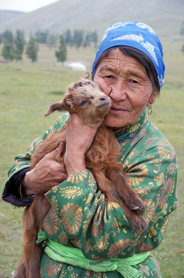 A woman with kid (ten days old) near Khovsgol Nuur (lake), North Mongolia 2010