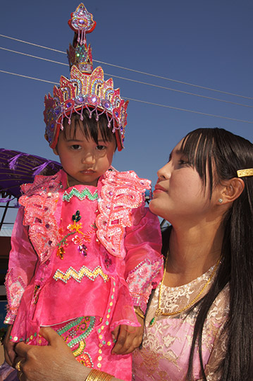 A mother and daughter adorned in The Buddhist Donation Ceremony parade, Popa 2015