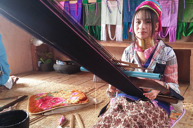 Long Neck Tribe woman weaving in Ywama village, Inle Lake 2015