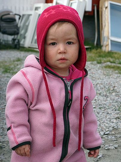 A toddler in a jumpsuit and a warm hat, 2017