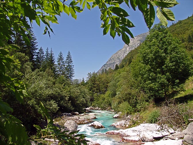 The emerald blue water of the Soca river flows across white gravel-beds, the Soca Trail 2007
