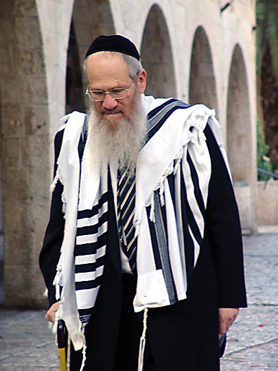 An orthodox Jew on his way to pray by the Western Wall, the Jewish Quarter, The Old City 2006