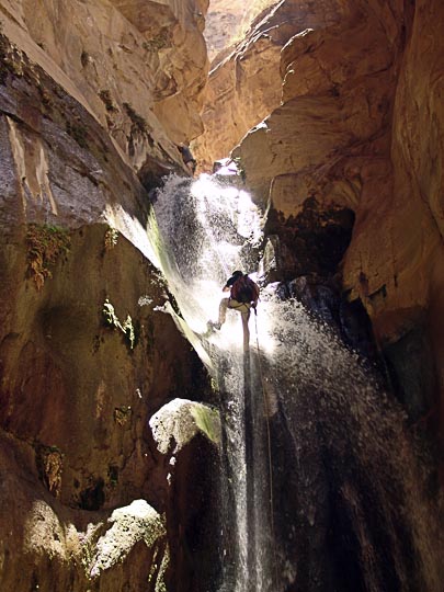 Shumo rappels (abseils) a waterfall in Wadi el Karak, 2007