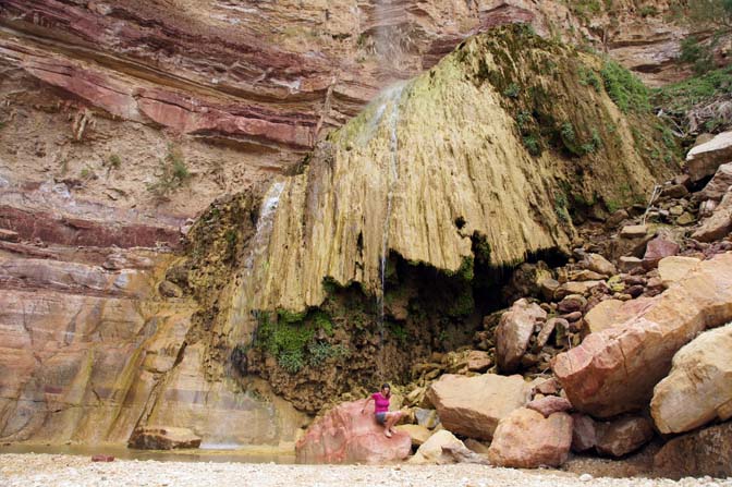 Moss-covered travertine umbrella at the bottom of the high waterfall of Wadi Himara, 2012