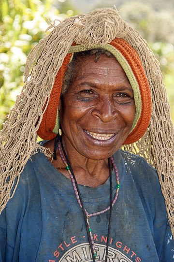 A Huli Tribe woman with a woven Bilum (string bag) on her forehead, Tari 2009