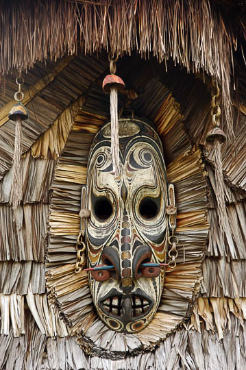 A mask decorating a Haus Tambaran (Spirit House) in Tambanum, the Sepik River 2009