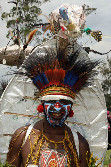 A man from Goroka in the Eastern Highland Province, carrying a turtle figure above his head at The Goroka Show 2009