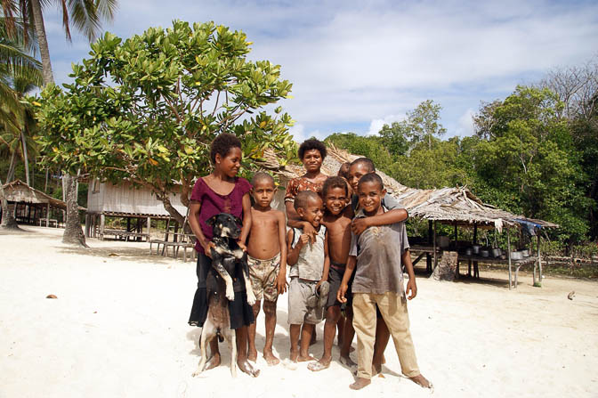 Locals on a white sand beach, Kabuni Village 2009