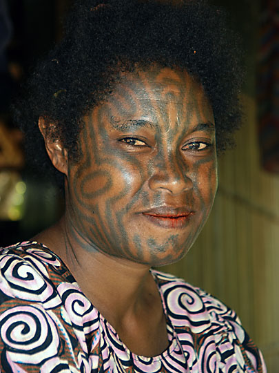 A woman with tattooed face, Kabuni Village 2009