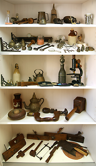 Collage of the right side of the display closet with items from the impressive collection, 2009