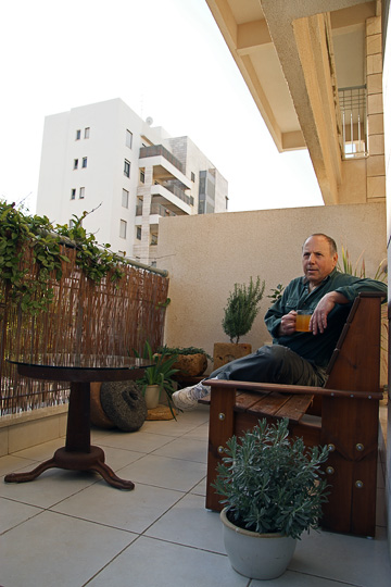 Jack Broner sips his tea on the balcony of his home, 2009