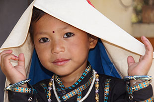 Sweet Rung girl in her traditional headdress  to a large gallery picture