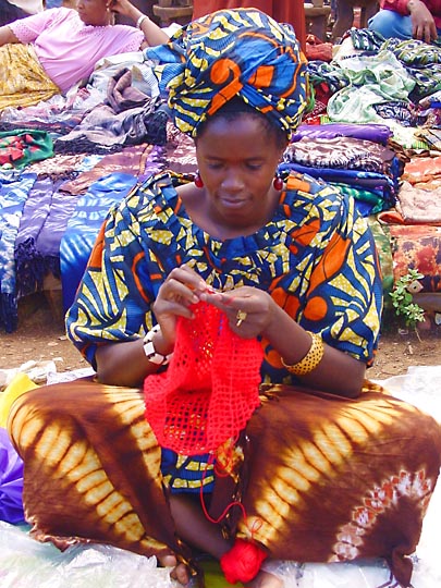 A local African knits in the Nairobi market, Kenya 2000