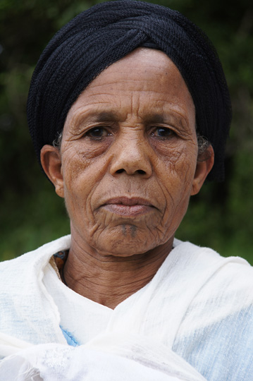 Woman with a typical headdress in the church yard on top of Mount Tabor, 2012