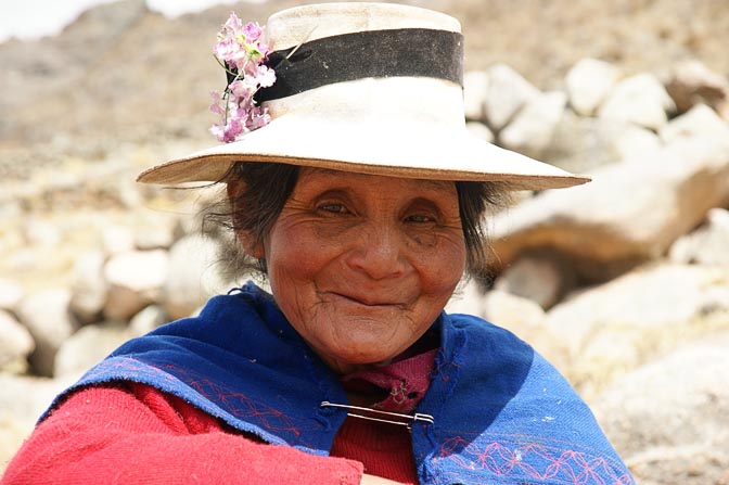 A Chola (local woman) with a flower-strewn hat, Hatun Machay, Cordillera Negra 2008