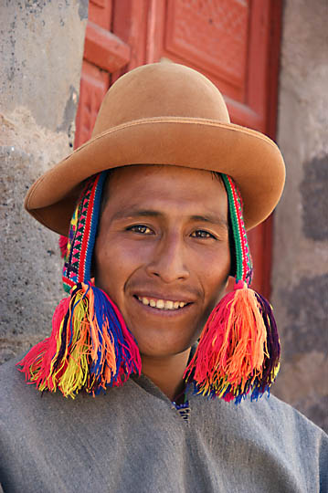 An Amerindian man with traditional hats in the street, Cusco 2008