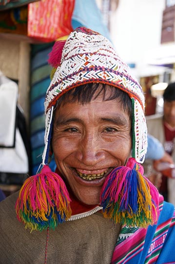 An Amerindian man with traditional beaded hat in the market, Cusco 2008