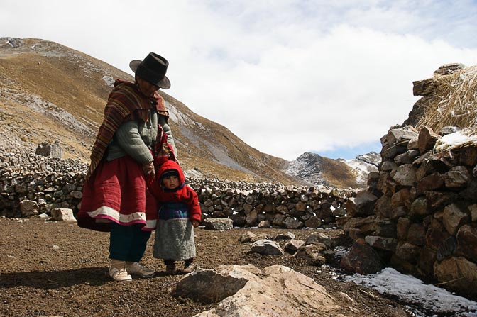 A nomad grandmother is looking after her grandchild, well dressed in the freezing cold, Tapush Punta 2008