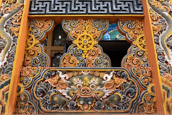 Colorful carved-wood decorations at Punakha Dzong, 2018