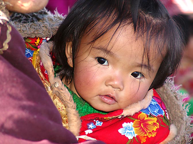 A Tibetan girl in a crowded ferry boat on the way to Samyai Monastery, 2004