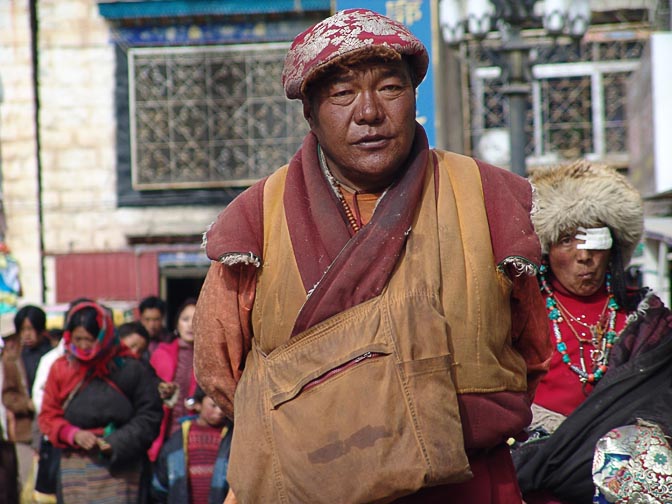 A Tibetan man along by the Lingkor around the Jokhang, Lhasa 2004