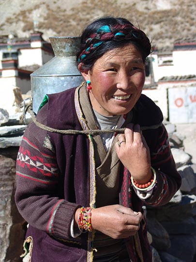 A Tibetan woman carrying a water jar close to Lhasa, 2004