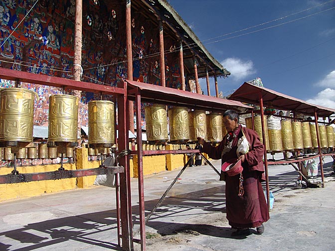 Prayer wheels and  Blue Buddha carvings in Chakpori, Lhasa 2004