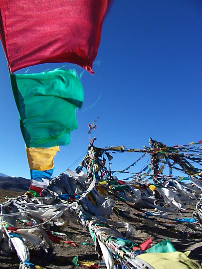 Colorful prayer flags fluttering in Lhakpa La (5,220m), 2004