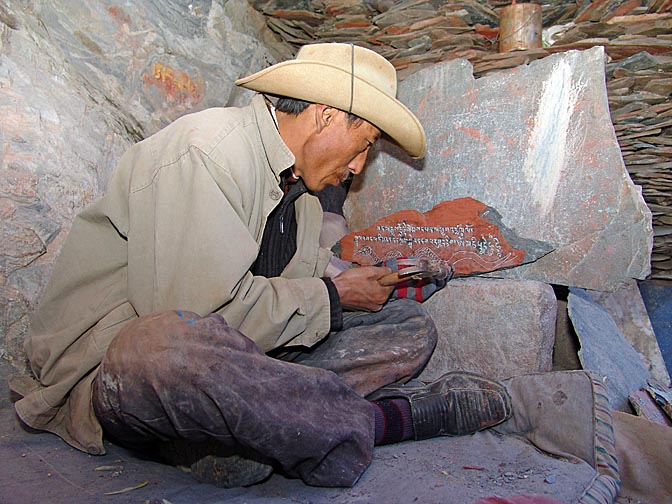 A rock carving artist by the Chakpori, Lhasa 2004