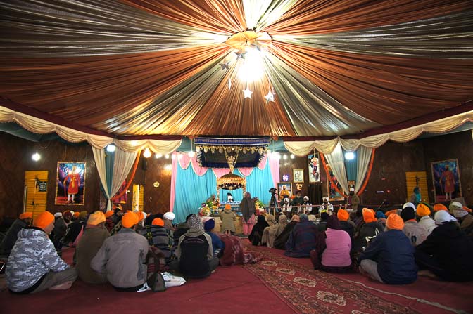 Prayer inside the Sikh temple (Gurdwara) at Hemkund, Garhwal Himalayas 2011