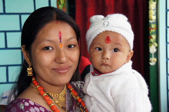 Kukku and his mom in a traditional Puja on behalf of his birth, Pangu 2011