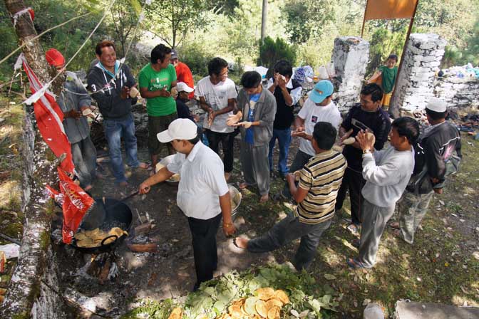 Men frying Puri bread on Maha Ashtami, the eighth day of Durga Puja festival, Pangu 2011