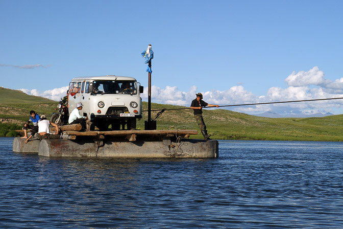 A UAZ Furgon car on a ferry crossing the Shishged Gol (river), North Mongolia 2010