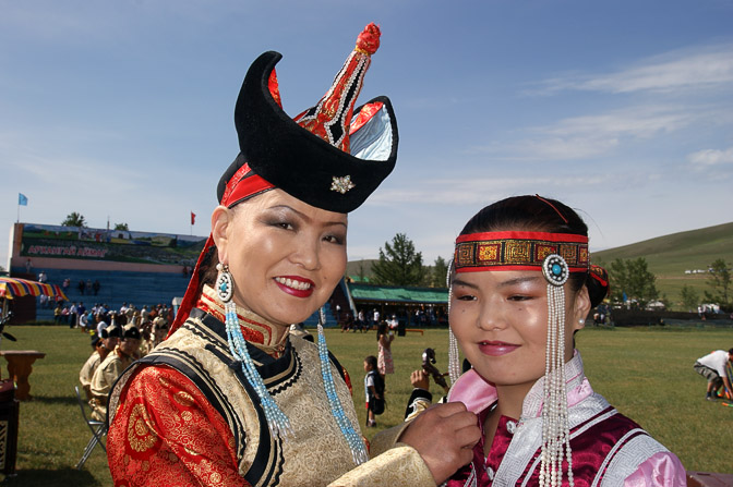 A singer gives a final touch to another performer in the opening ceremony, Tsetserleg 2010