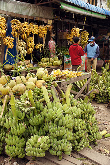 Bananas and coconuts stall in the market, Mandalay 2015