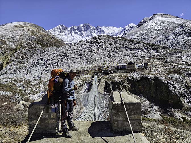 Ramesh by the suspension bridge on the way from Shree Kharka to Yak Kharka, 2023