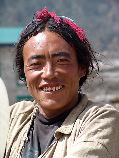 A smiling Tibetan trader in Khumjung, 2004