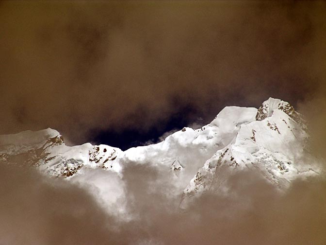 The north-west face of the Kangchenjunga, gushed from the clouds at sunset in Pangpema, 2006