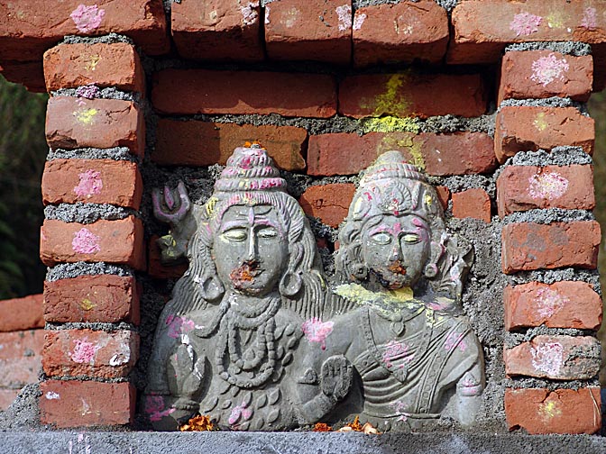 Stone figures, in a small shrine, 2004