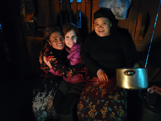 Warming up and cuddling in the kitchen at the Shangrila Guesthouse in Dang, 2022 (photographed by Renee Buskermolen)