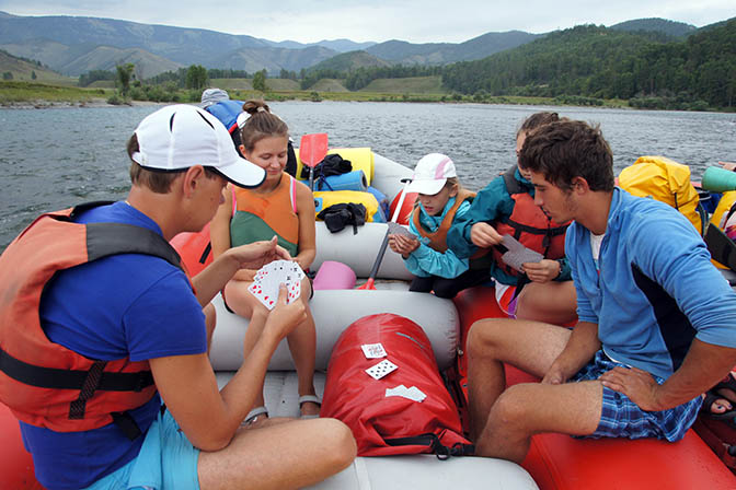 Playing cards in the calm rafting parts on the Katun river, 2014