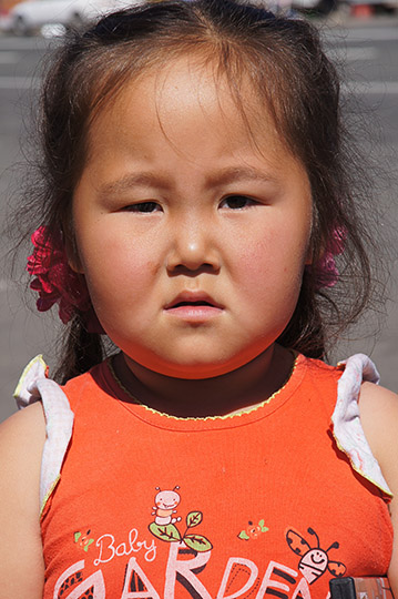 Girl at the stalls on the M52 highway to Mongolia, 2014